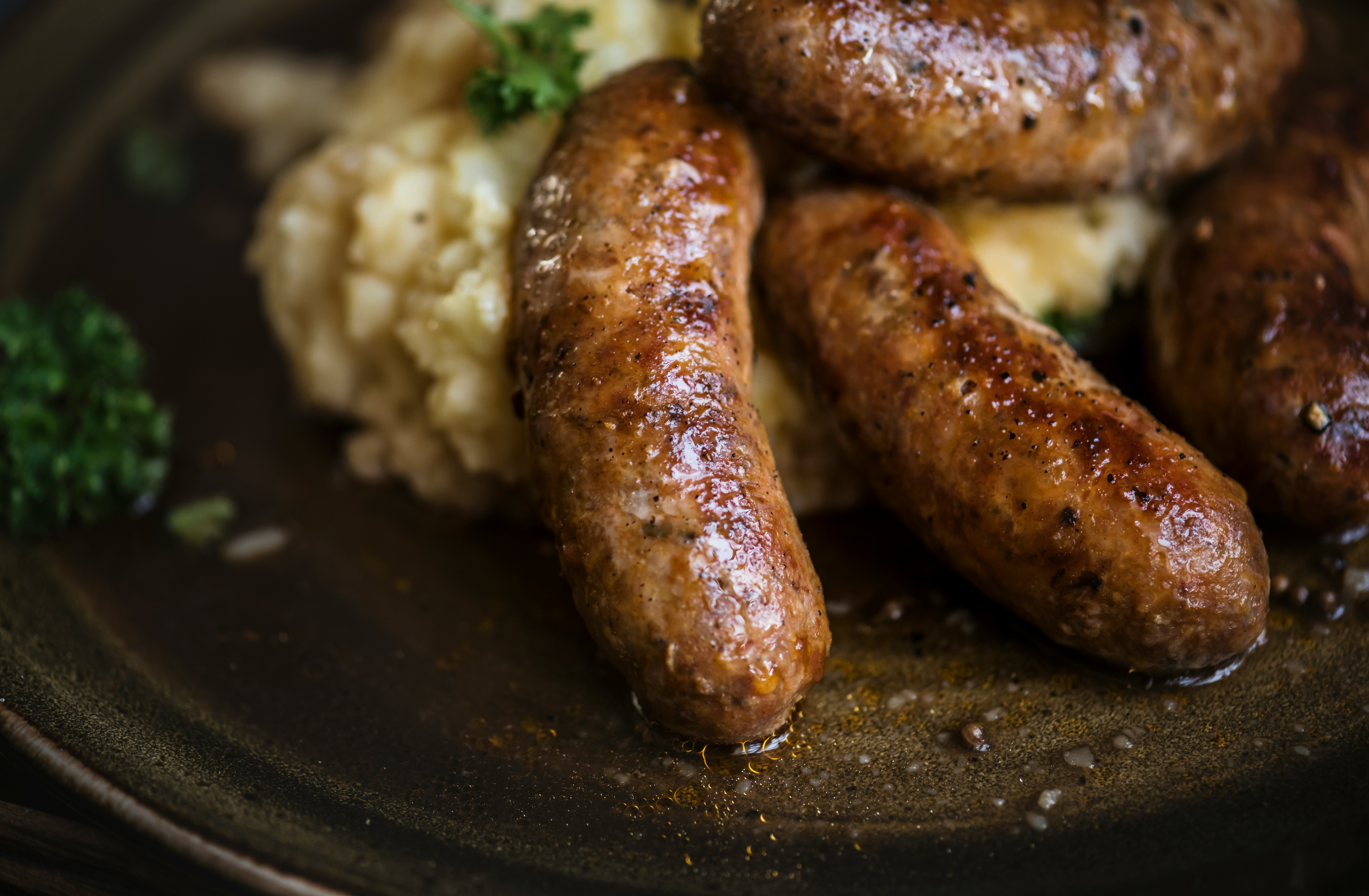 Grilled sausage served with potatoes