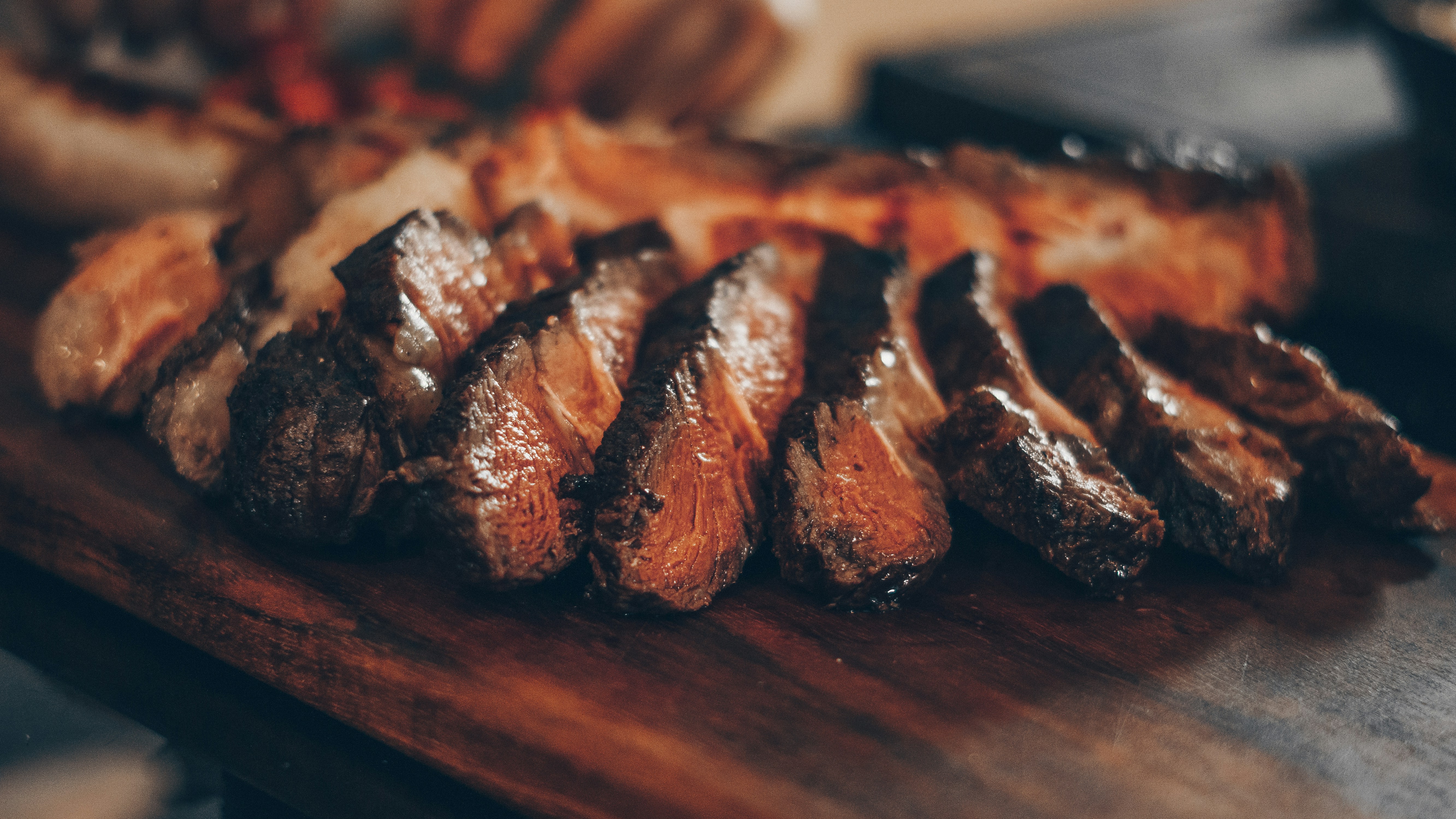 Sliced grilled meat on a cutting board